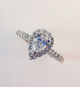Photo of sparkling engagement ring with many diamonds.