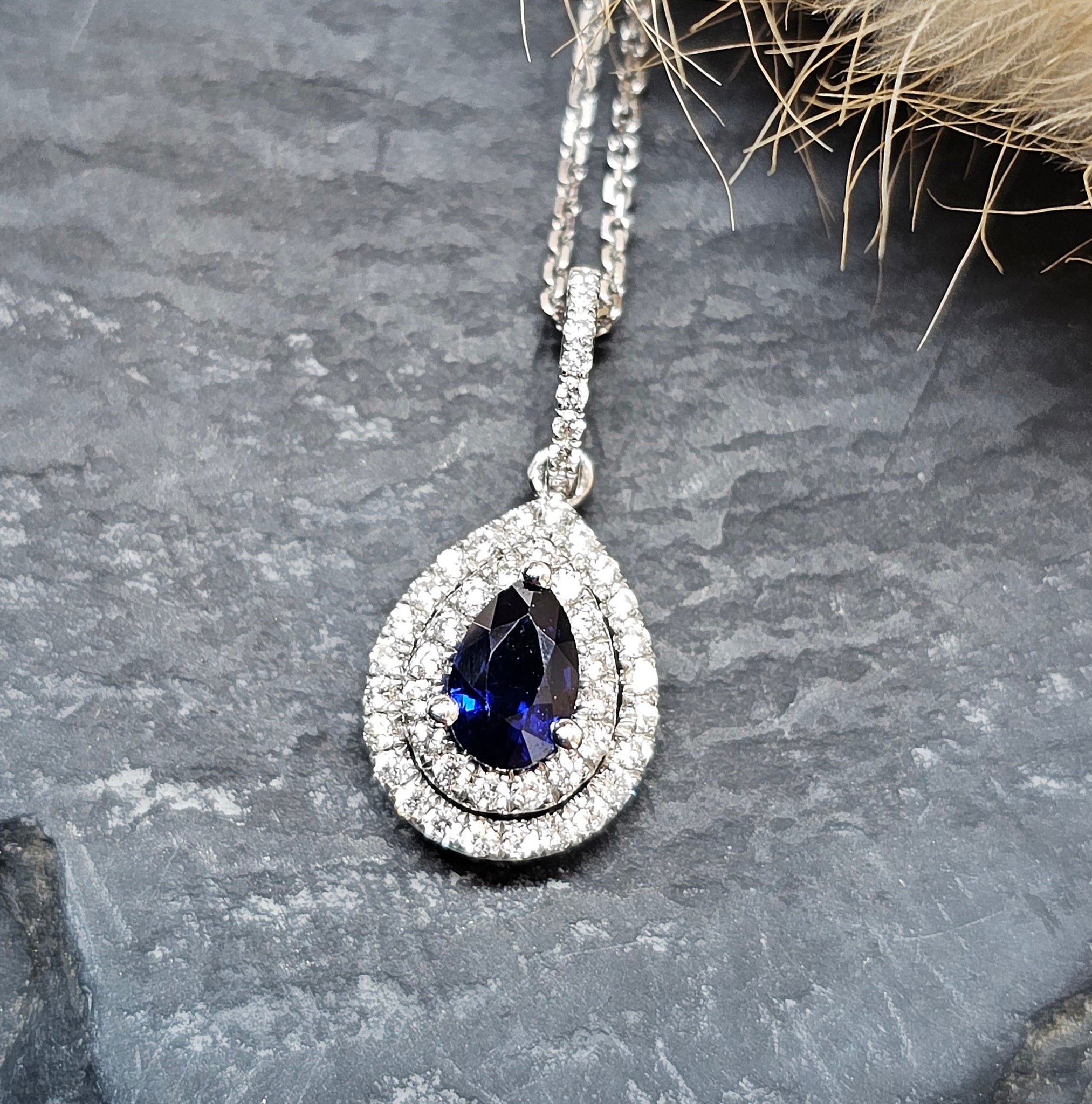 Pear cut sapphire and diamond double halo pendant