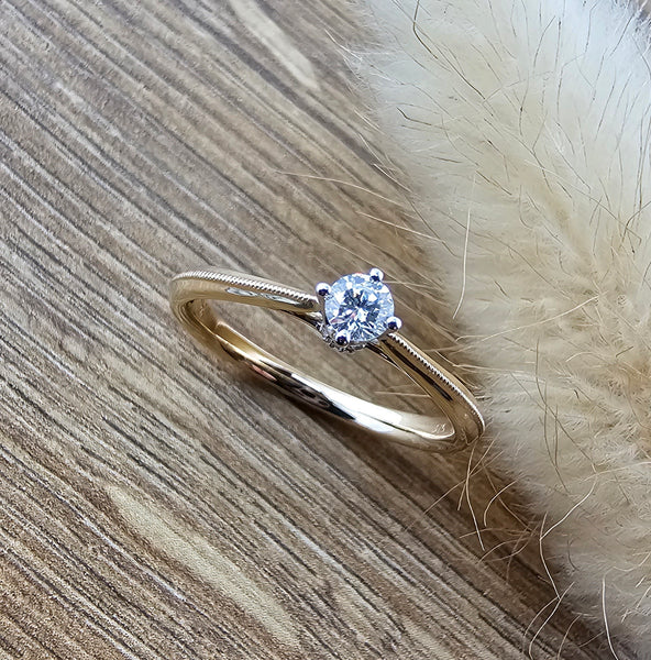 Beaded trim diamond solitaire ring