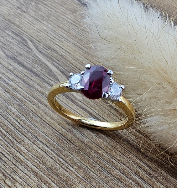 Oval ruby and diamond trilogy ring