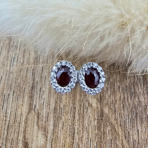 Oval ruby and diamond halo stud earrings