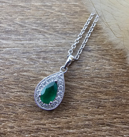 Pear cut emerald halo pendant