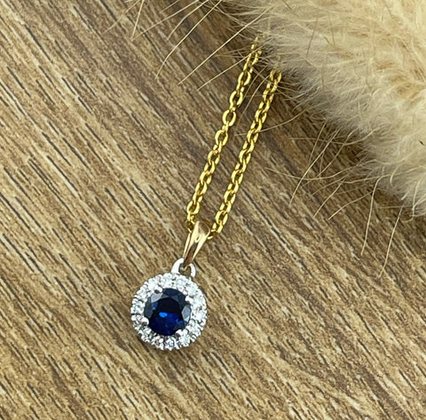 Sapphire and diamond round halo pendant