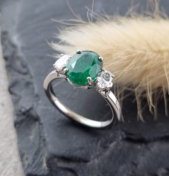 Large oval emerald and diamond trilogy ring