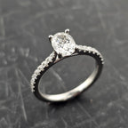 Oval Solitaire with Diamond Shoulders