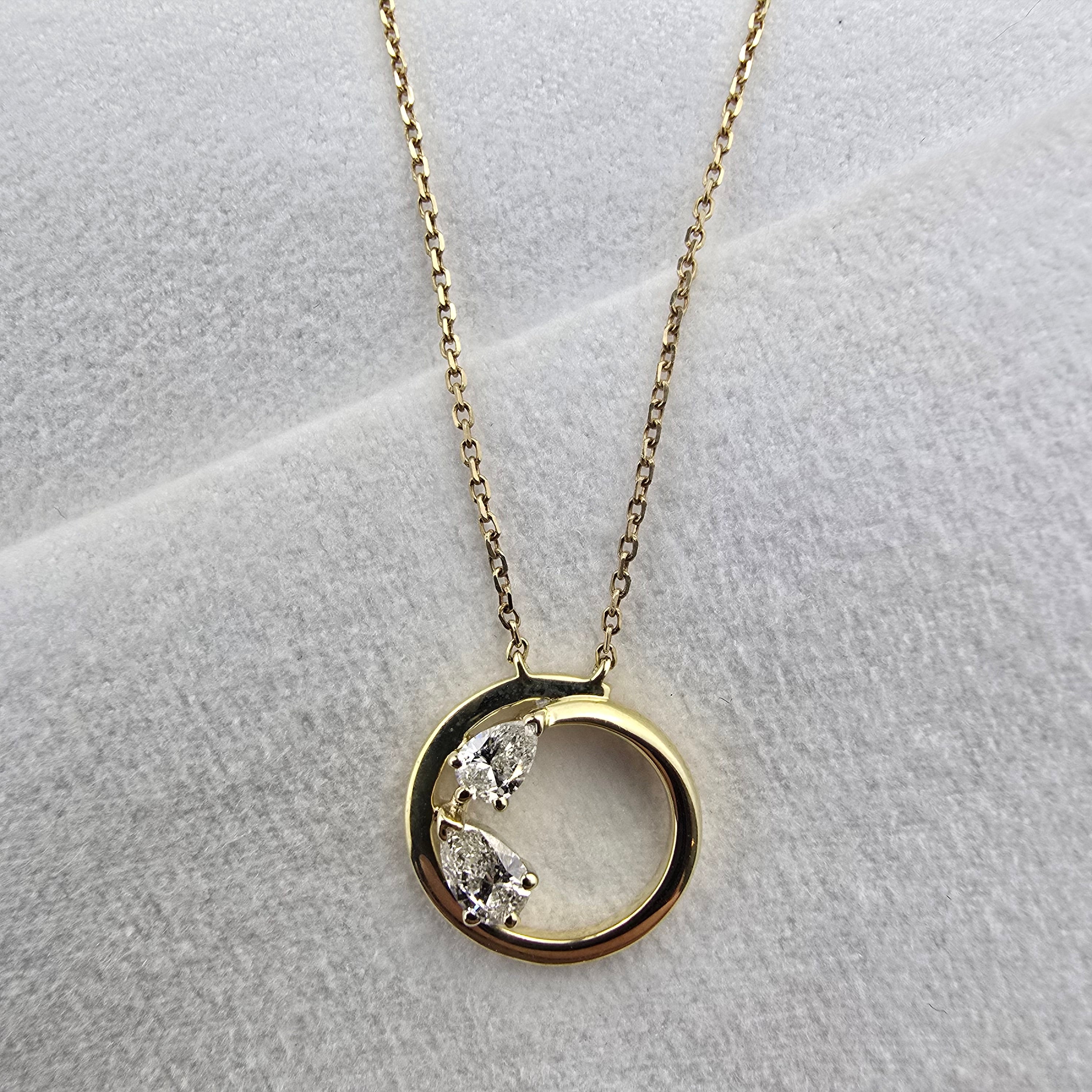 Circle Pendant with Pear Diamond Details