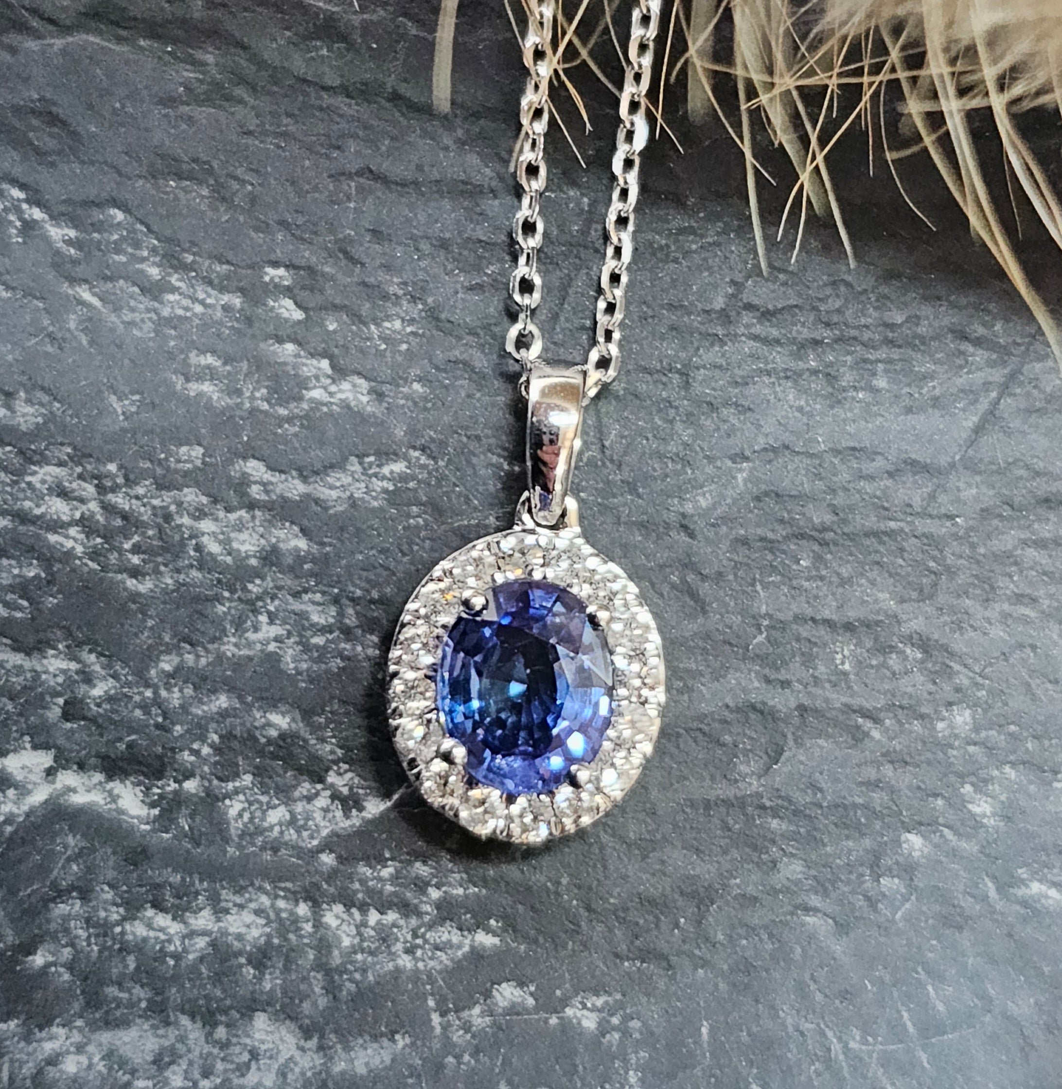 Oval sapphire halo pendant