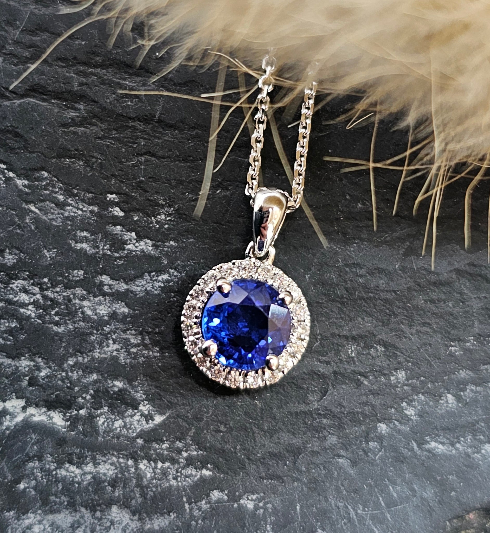 Sapphire and diamond halo pendant