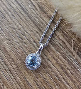 Round aquamarine halo pendant