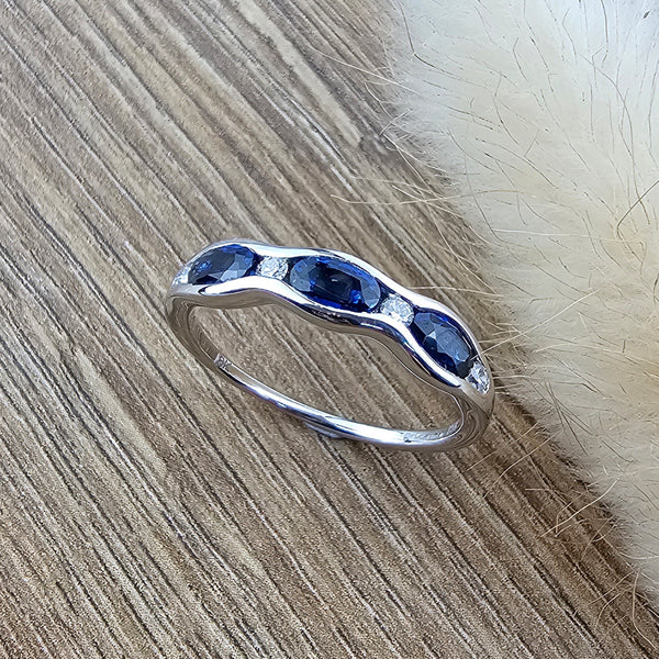 Wave channel set sapphire ring
