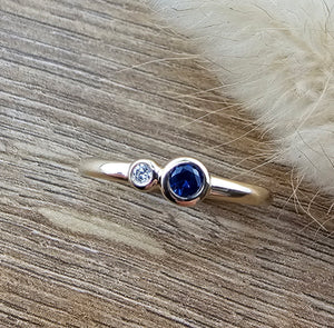 Sapphire two stone rubover ring