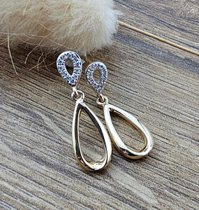 Elongated pear shaped diamond drop earrings