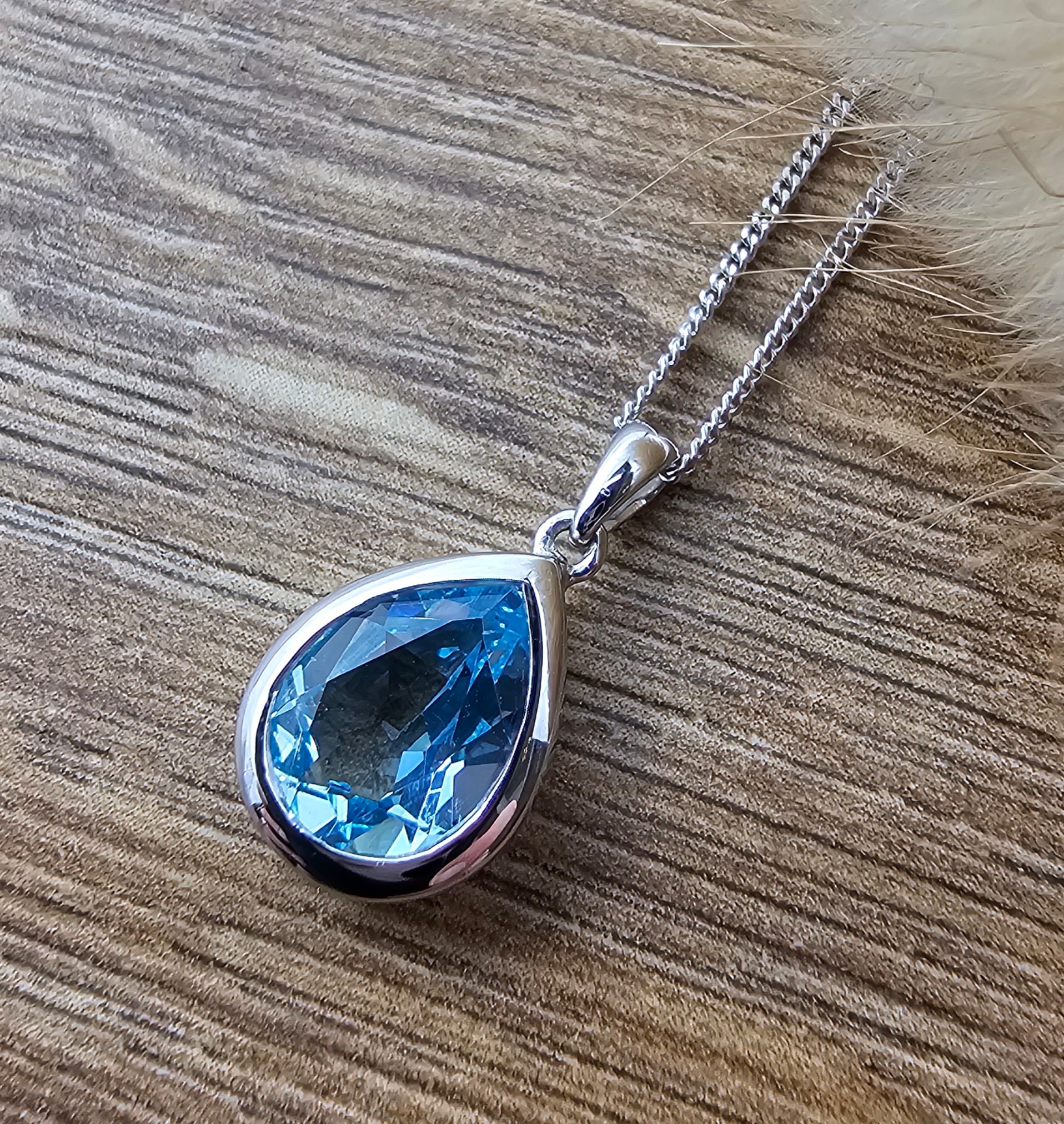 Pear cut blue topaz rubover pendant