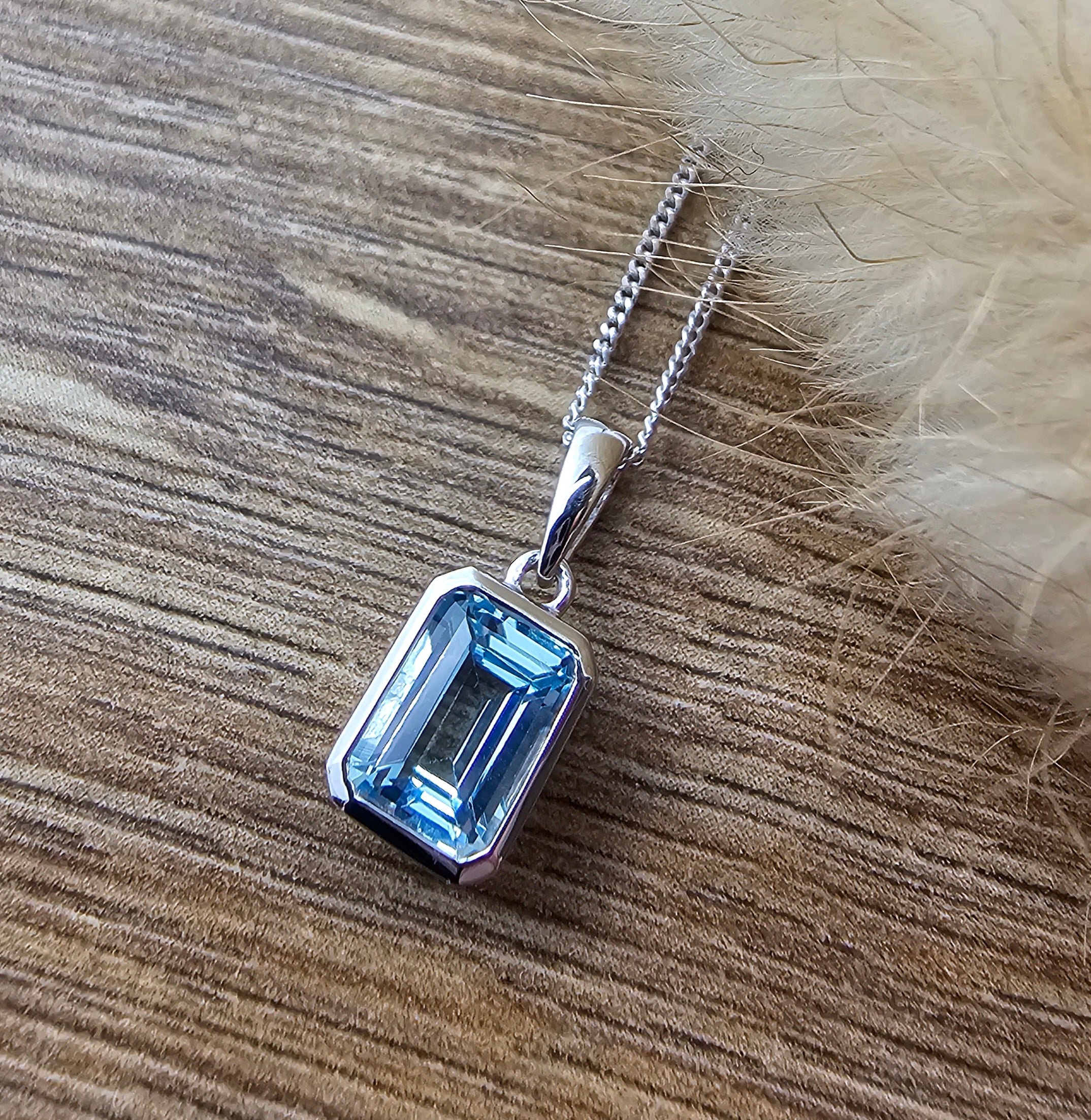 Octagonal blue topaz rubover pendant