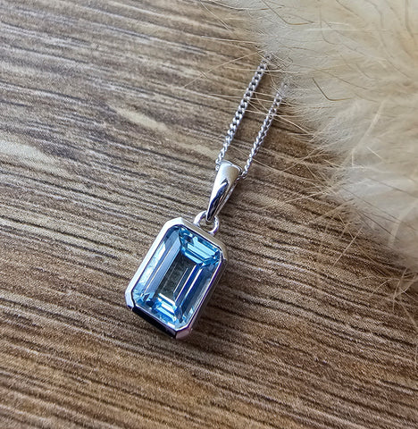 Octagonal blue topaz rubover pendant