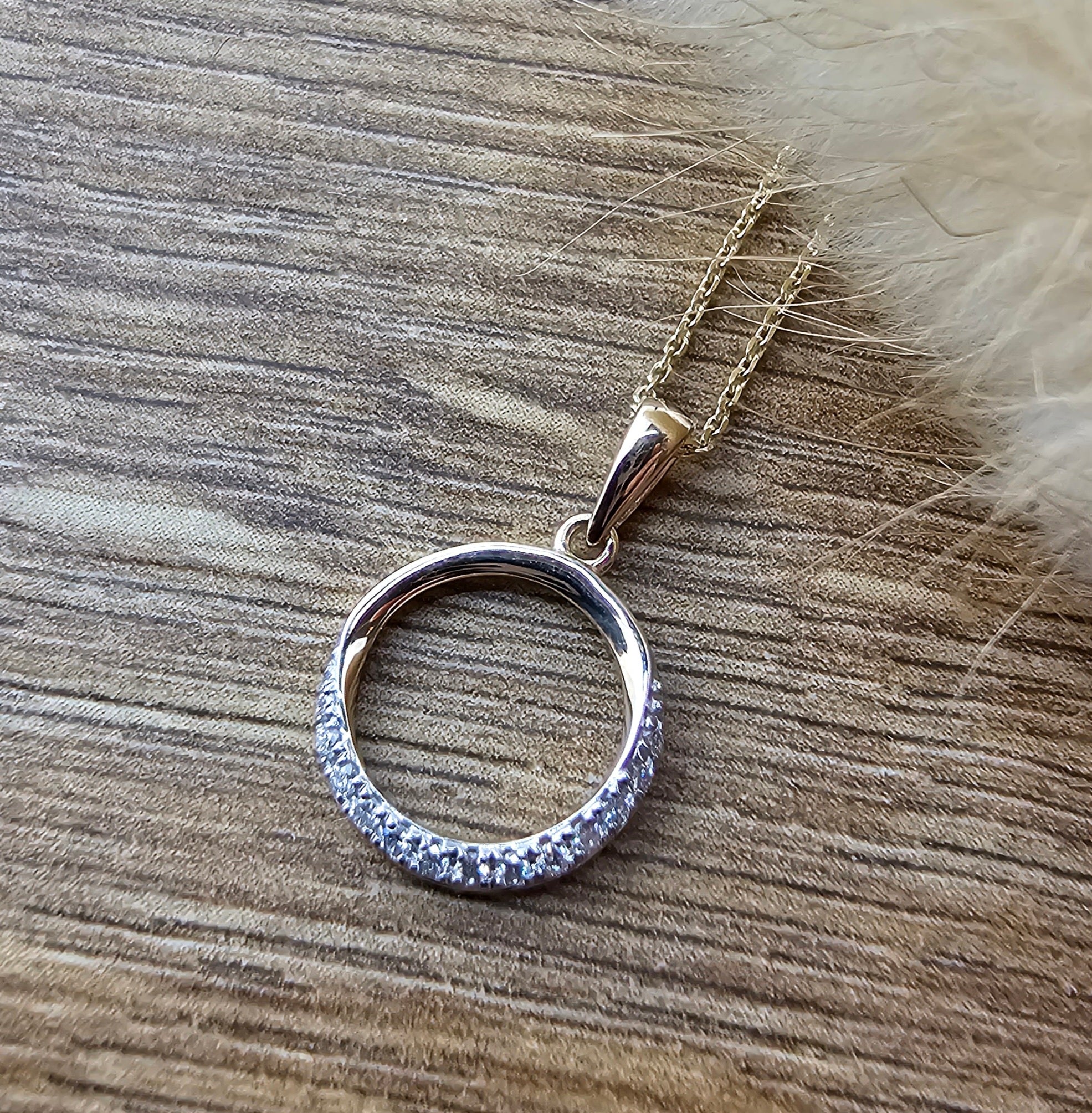 Diamond set open circle pendant