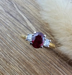 Oval ruby and diamond trilogy ring