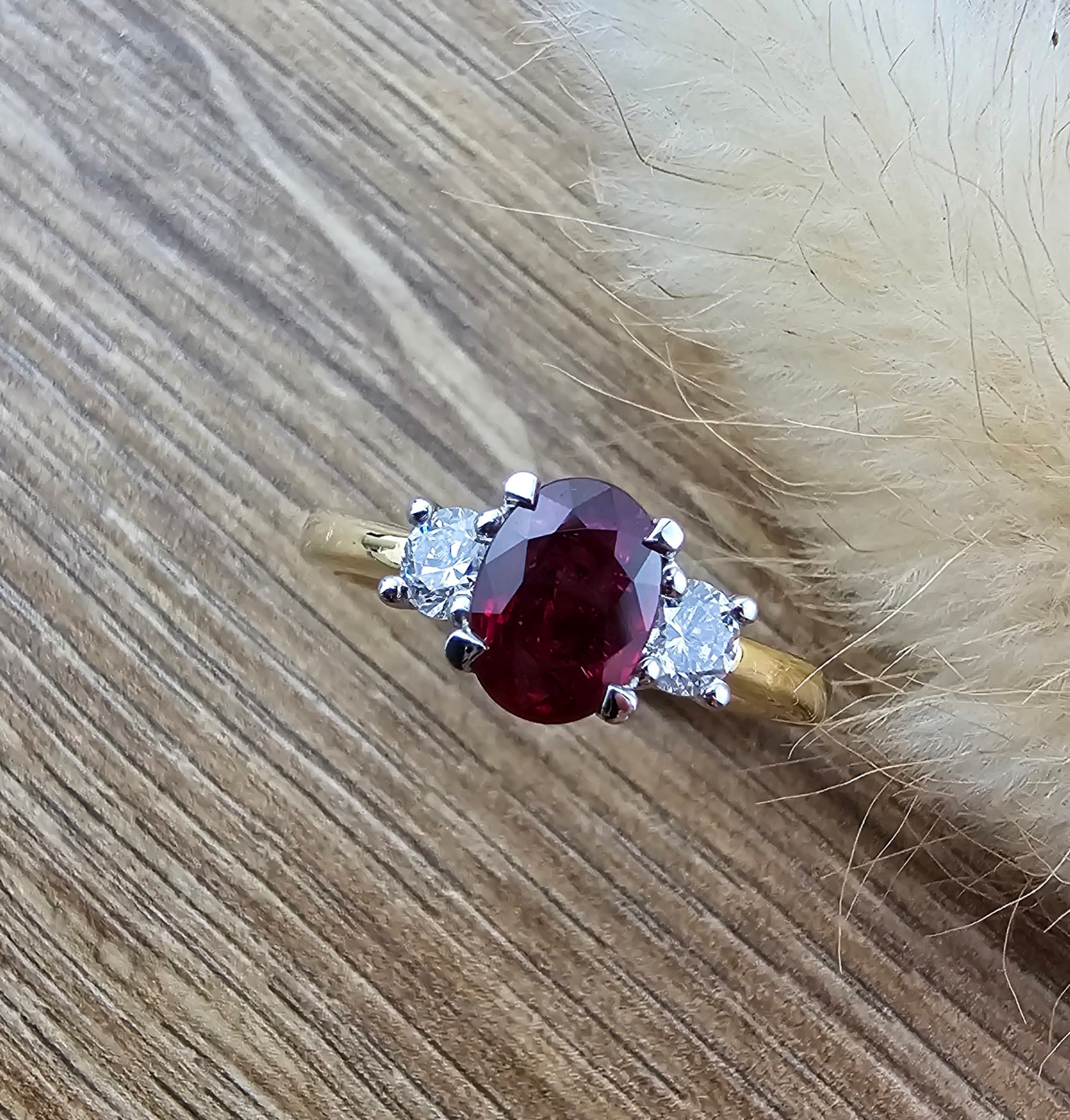 Oval ruby and diamond trilogy ring