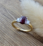 Oval ruby and diamond trilogy ring