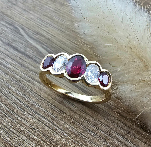 Oval ruby and diamond rubover ring