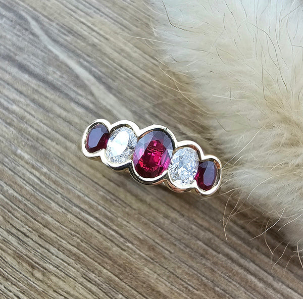 Oval ruby and diamond rubover ring