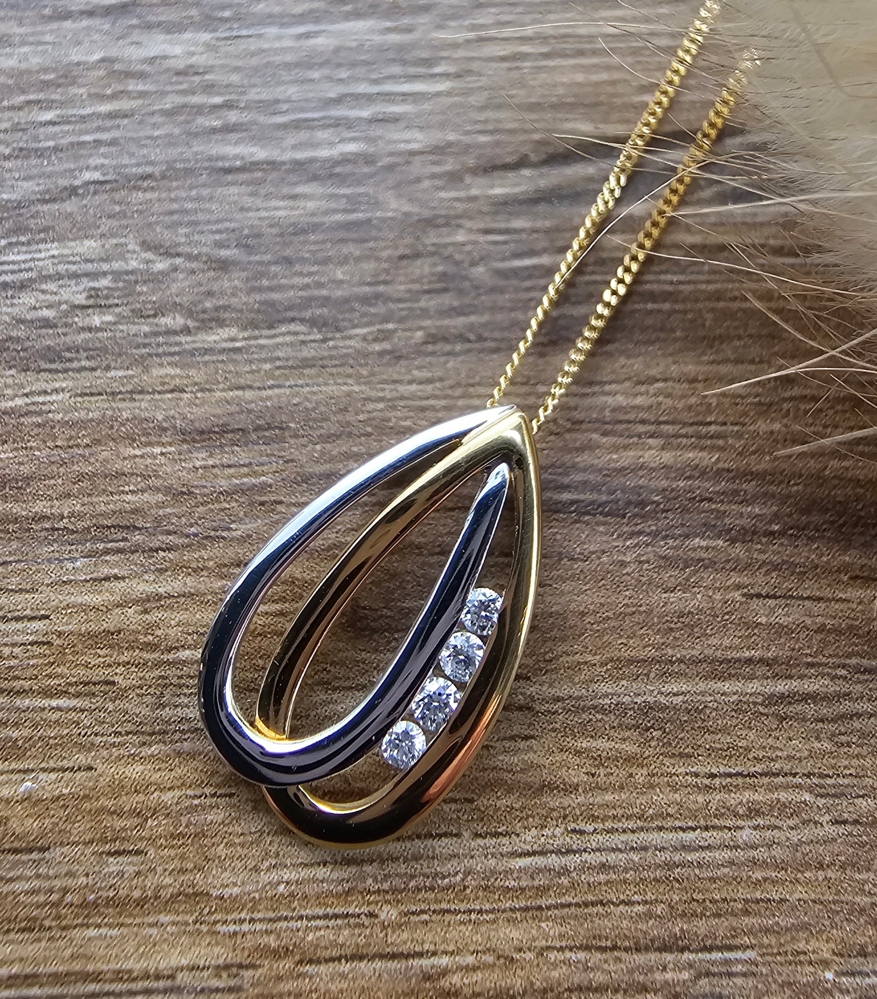 Two colour gold diamond entwined pendant