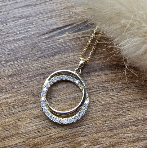Gold swirl diamond pendant