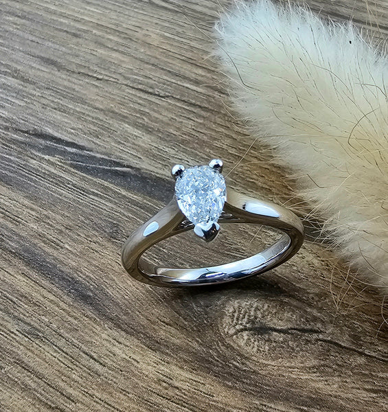Pear cut diamond solitaire tapered ring