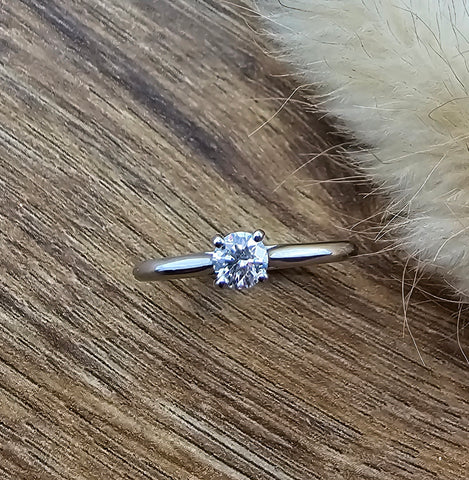 Slim round diamond solitaire engagement ring