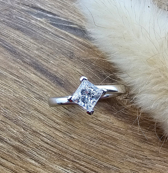 Princess cut diamond solitaire twist ring
