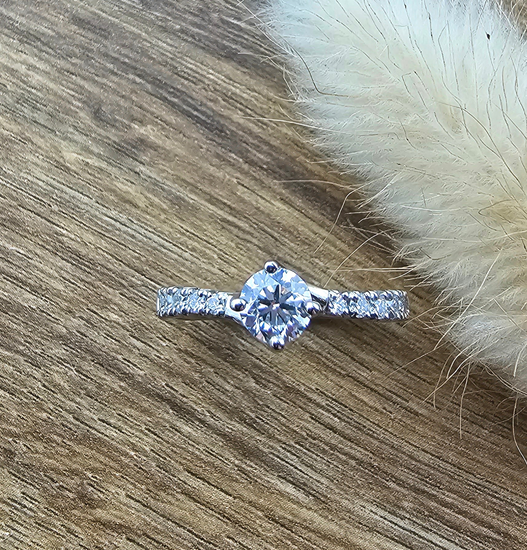 Round diamond claw set twist engagement ring