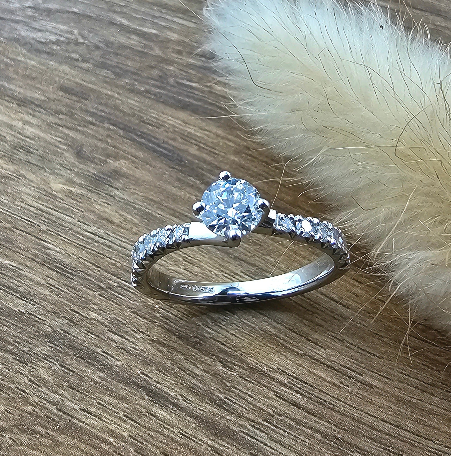 Round diamond claw set twist engagement ring