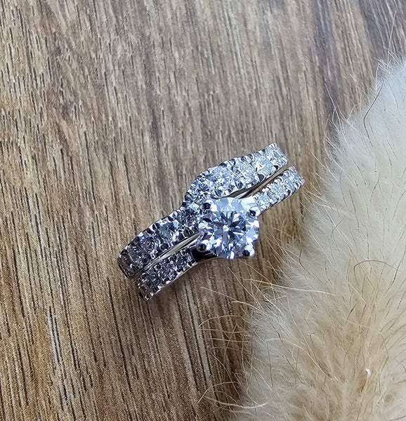 Round diamond claw set twist engagement ring