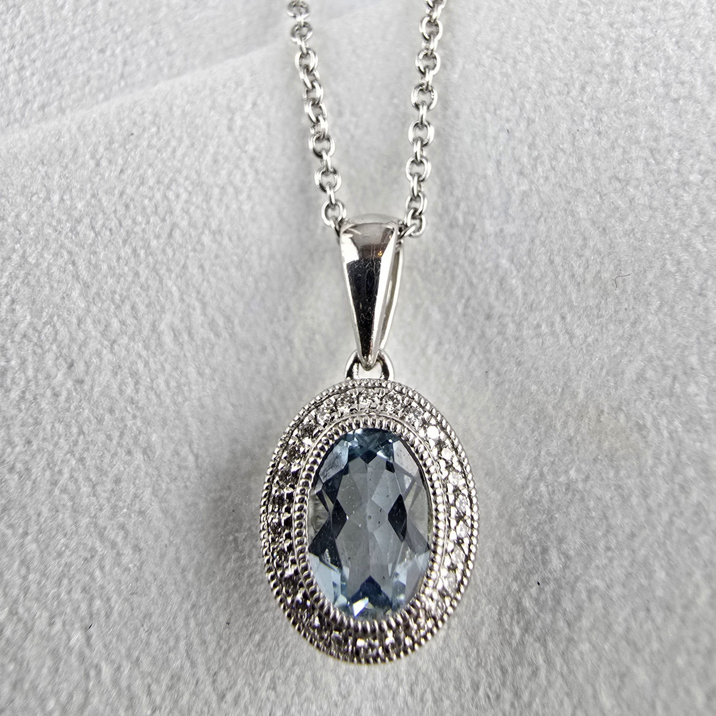 Aquamarine halo pendant