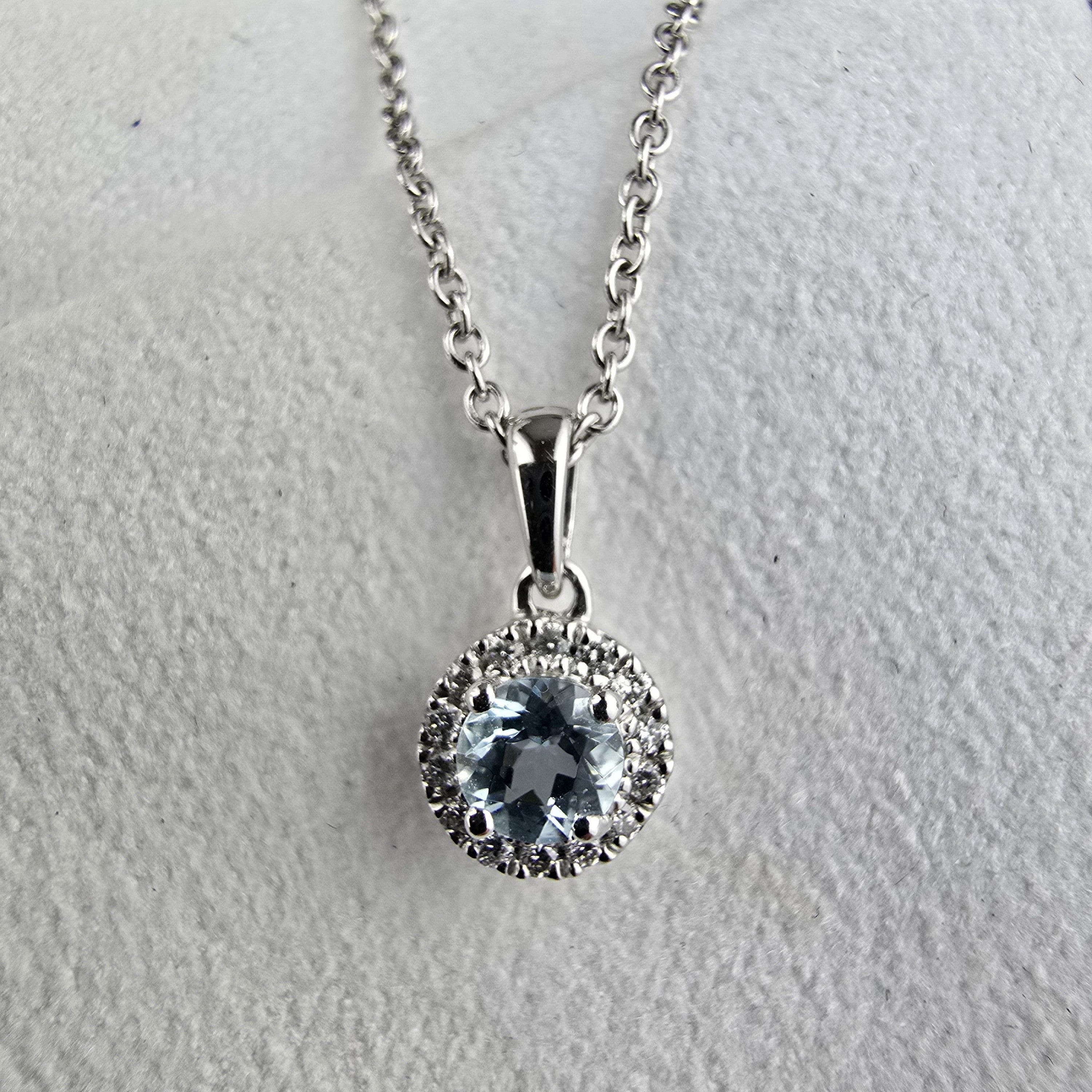 Round aquamarine halo pendant