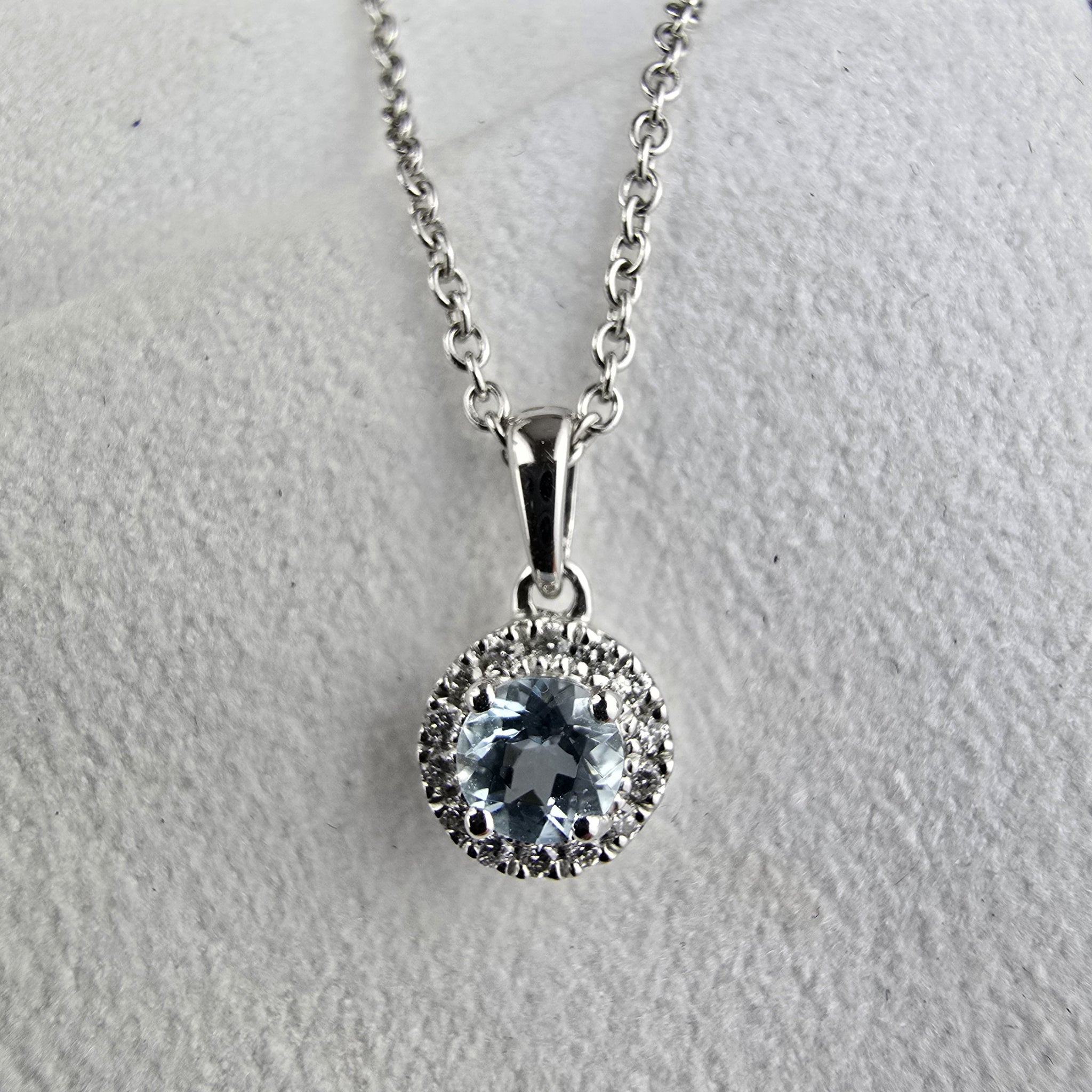 Round aquamarine halo pendant