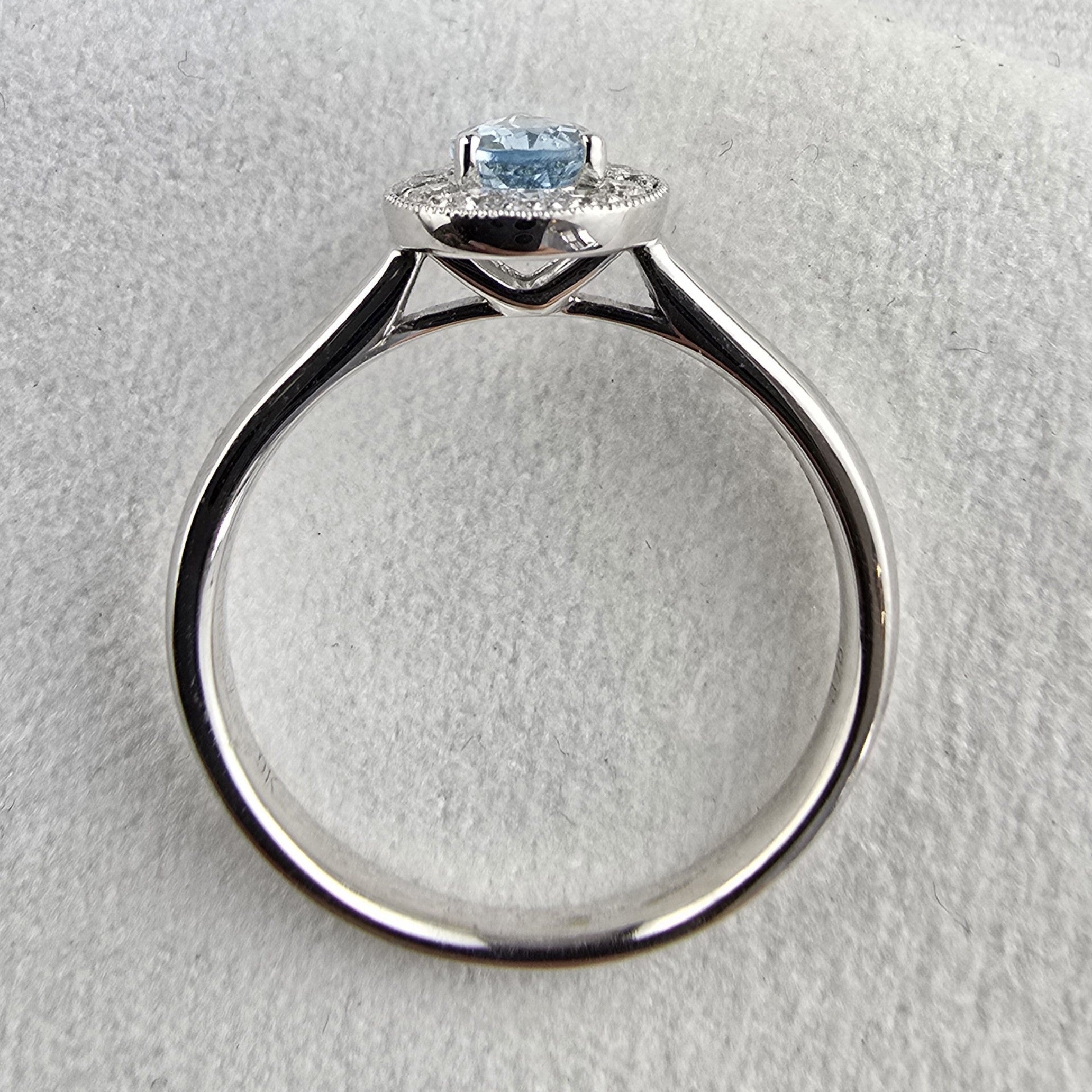Pear shaped halo aquamarine ring
