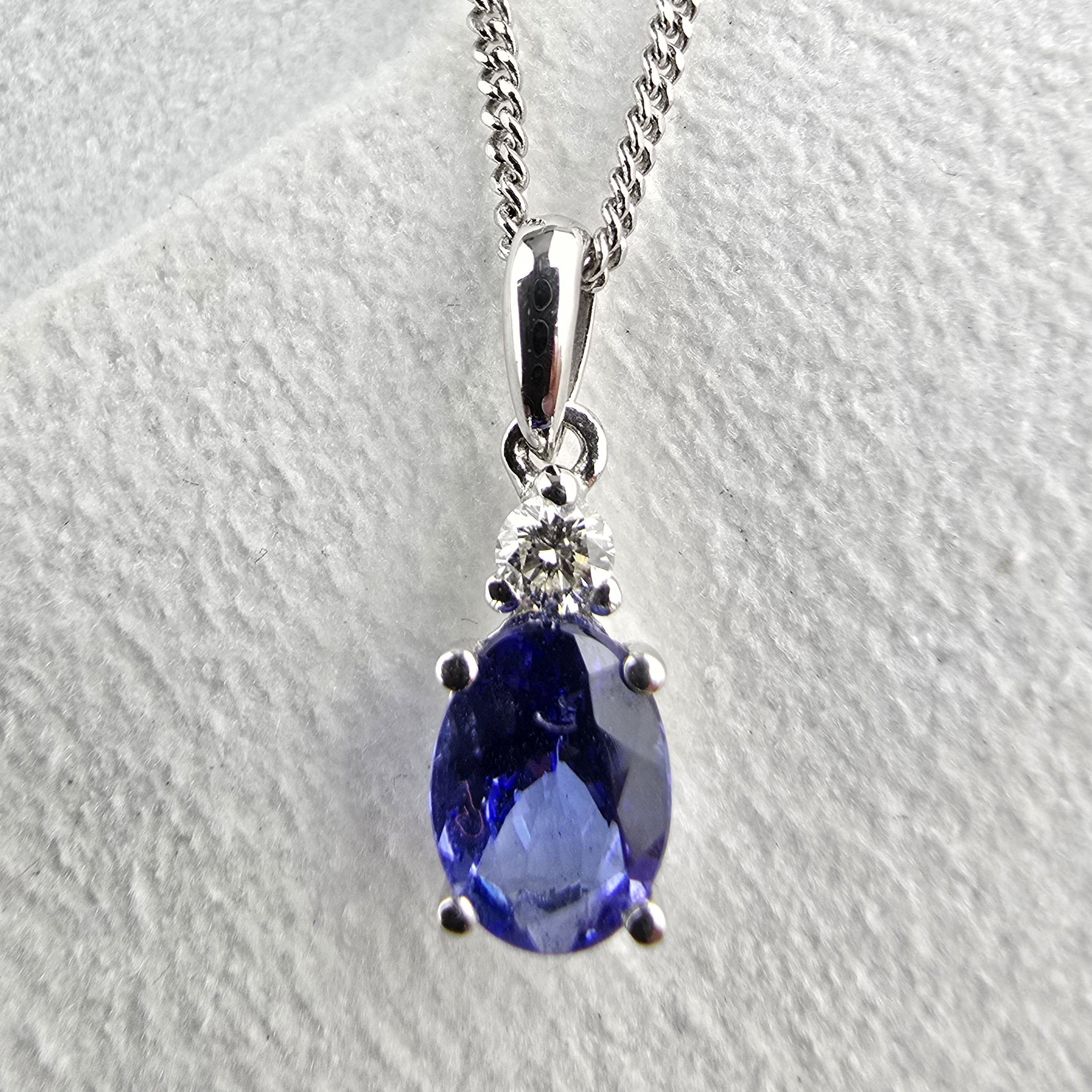 Oval tanzanite and diamond pendant