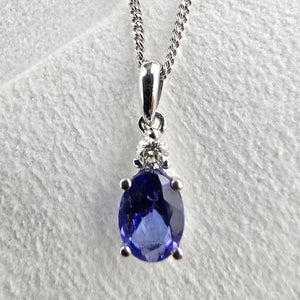 Oval tanzanite and diamond pendant
