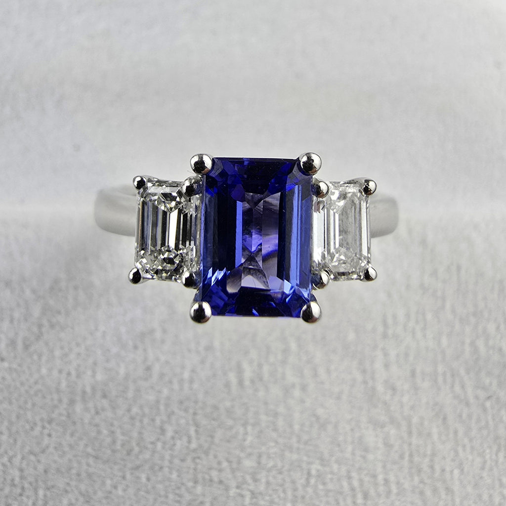 Octagonal cut tanzanite and diamond three stone ring