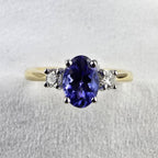Oval tanzanite and diamond three stone ring