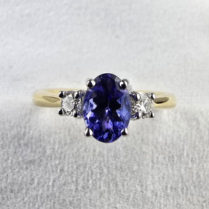 Oval tanzanite and diamond three stone ring