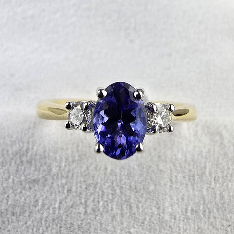 Oval tanzanite and diamond three stone ring