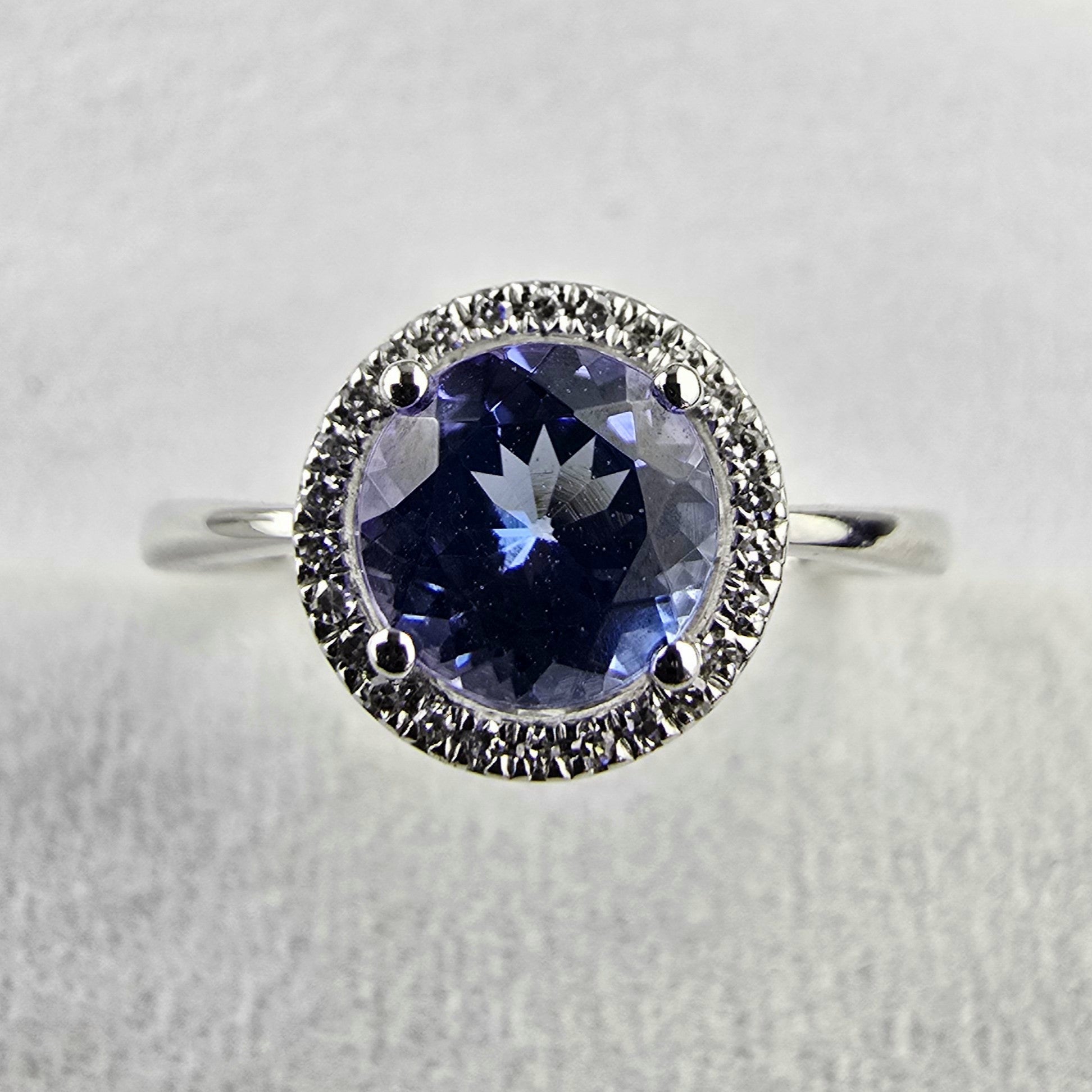 Round tanzanite halo ring