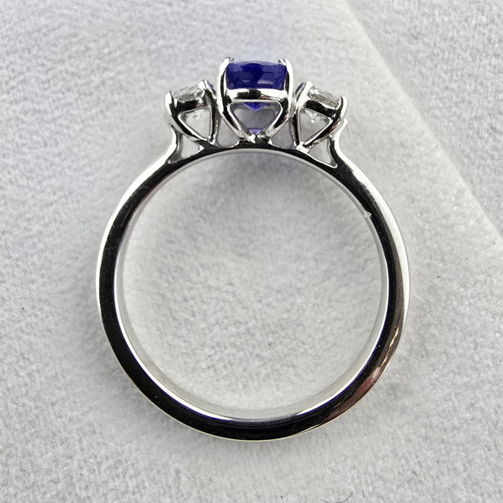 Large oval tanzanite and diamond three stone ring