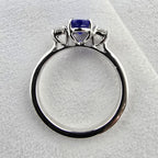 Large oval tanzanite and diamond three stone ring