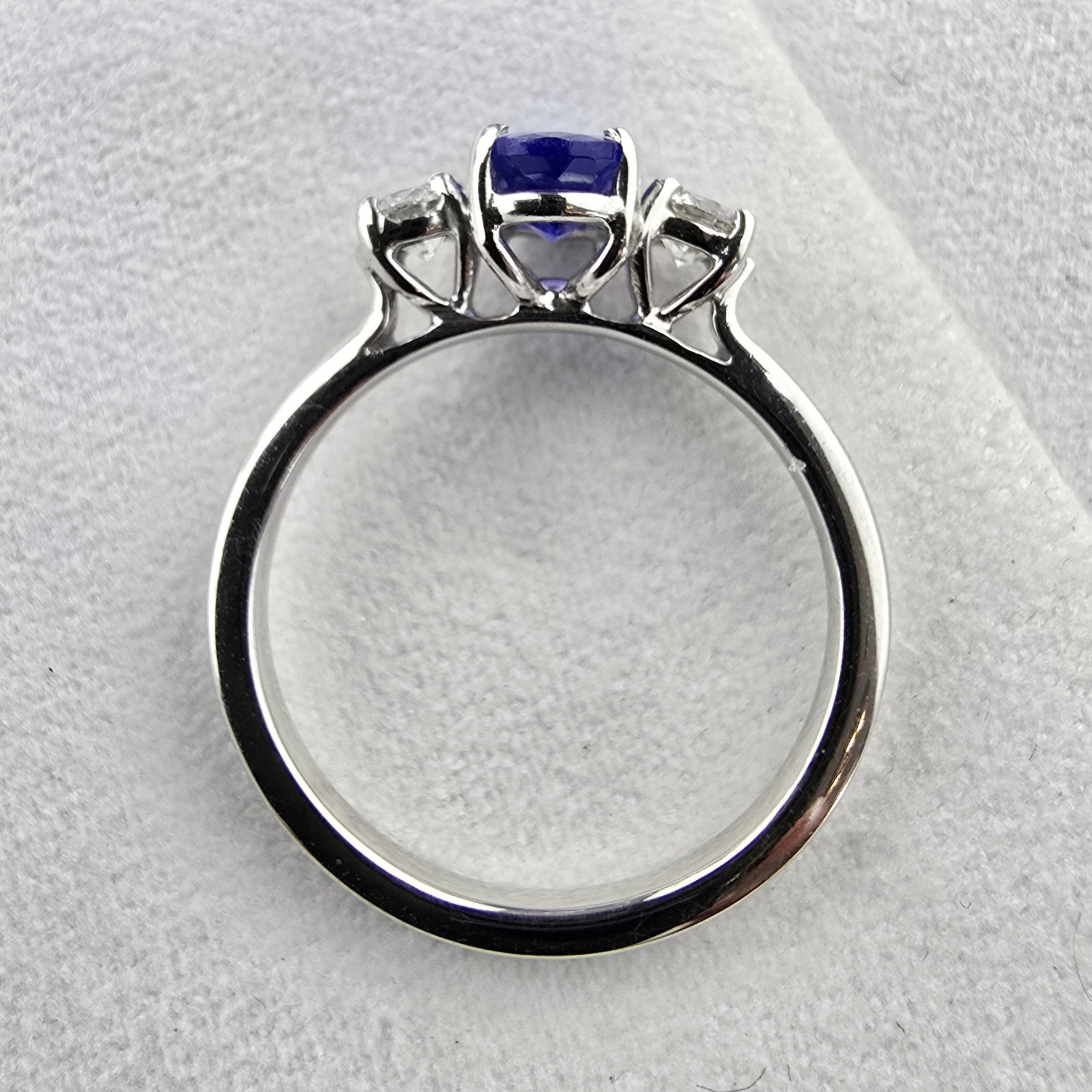 Large oval tanzanite and diamond three stone ring