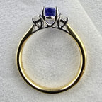 Oval tanzanite and diamond three stone ring
