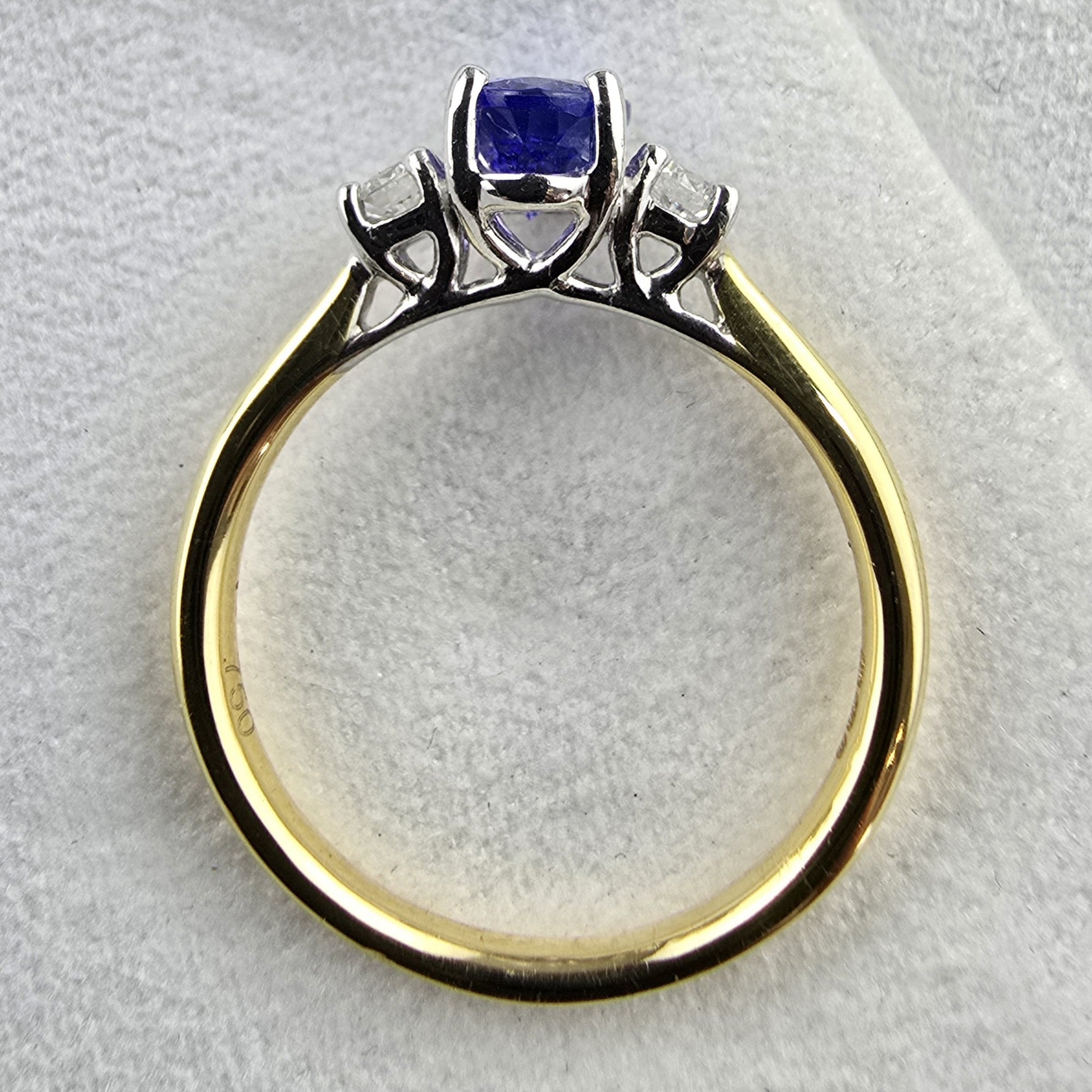 Oval tanzanite and diamond three stone ring