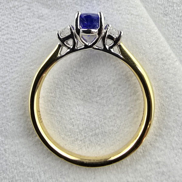 Oval tanzanite and diamond three stone ring